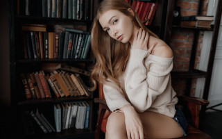 Woman sitting library portrait book - a chair in front free wallpaper