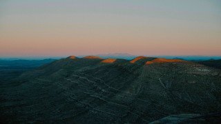 Mountain range sunset pink sky 3 - a view of a mountain range free wallpaper