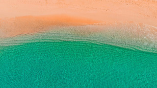 Beach ocean sand boat sky - a sandy beach free wallpaper