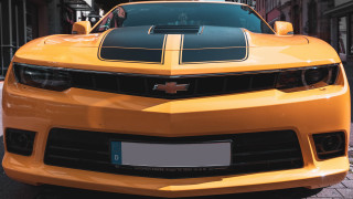 Yellow sports car black stripe 2 - a black stripe free wallpaper