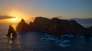 Sunset ocean rock formation water - a sunset over the ocean free wallpaper