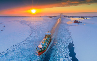 Frozen lake boat sunset mountains - sunset free wallpaper