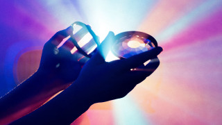 Light bulb hologram luminais glowing - a person holding free wallpaper