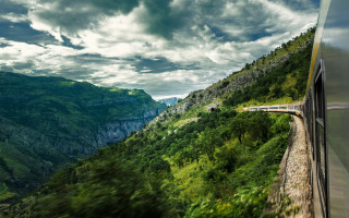 Lush green mountain train cloudy - a train free wallpaper