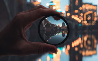 City lights bokeh microscopic camera - a person holding free wallpaper
