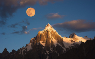 Full moon mountain range evening - cloud and snow free wallpaper
