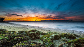 Beach sunset rocky shore mountain - a rocky shoreline free wallpaper