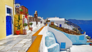 Narrow street blue door yellow - a yellow building free wallpaper