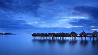 Huts water night cloudy sky - top of a body free wallpaper