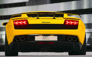 Yellow sports car clock building - the rear free wallpaper