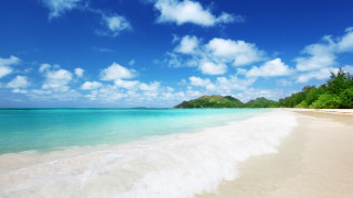 Beach sky clouds sand wave - a white sand beach free wallpaper