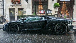 Black sports car rainy street - moody free wallpaper