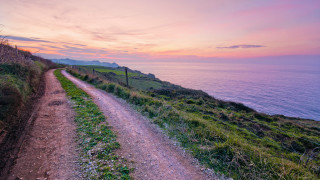 Dirt road hill ocean sunset - sunset free wallpaper