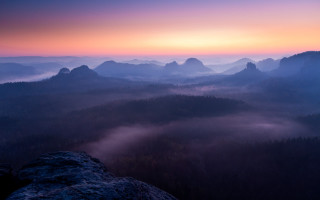 Mountain range foggy valley sunset - a pink sky free wallpaper
