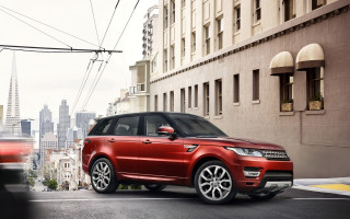 Red range rover city street - a city street free wallpaper