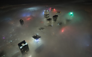 Foggy night cityscape lights skyscraper - a foggy night free wallpaper