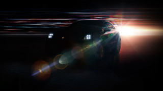 Car lights bokeh lens flare - a dark street free wallpaper