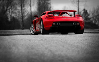 Red sports car tiltshift cherryblossoms - a red sports car free wallpaper