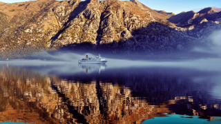 Boat mountain mist city night - cinematic photography free wallpaper