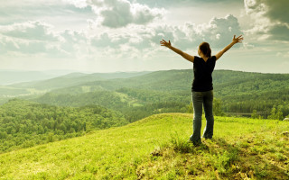 Woman hands outstretched hill mountains - widescreen free wallpaper
