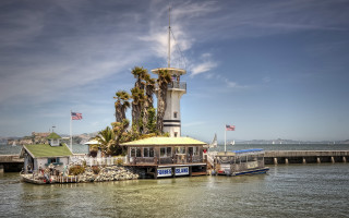 Boat pier lighthouse flag ocean - a pier free wallpaper