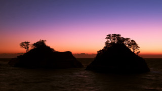 Rocks water sunset trees cityscape - top of them free wallpaper