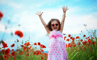 Girl arms up flower field - cheerful free wallpaper
