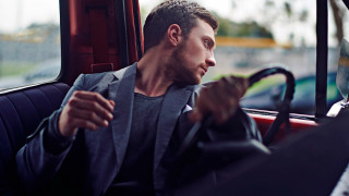 Man sitting bus cigarette looking - a bus free wallpaper