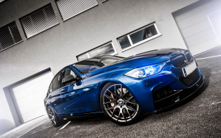 Blue car building garage open - a blue car free wallpaper