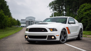 White mustang parking lot trees - the background and a building in the background free wallpaper