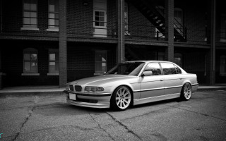 Silver car building parking lot - a silver car free wallpaper