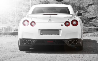 White sports car rear lights - a parking lot free wallpaper