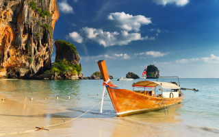 Beach boat rock outcropping sky - the beach free wallpaper