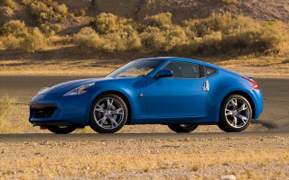 Blue sports car desert road 4 - a dry grass field free wallpaper