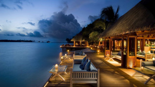Dock chairs lights night water - roof free wallpaper