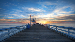 Pier lighthouse sunset ocean clouds - a light house free wallpaper