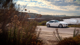 White sports car lake road - clean line free wallpaper