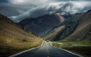 Mountain road truck cloudy sky 3 - a mountain range in the background free wallpaper