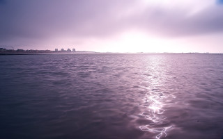Cityscape beach ocean sunset clouds - a few wave free wallpaper