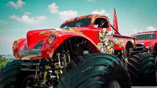 Red truck monster wheels field - a red truck free wallpaper