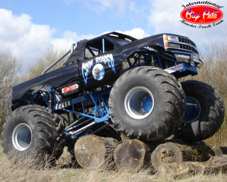 Monster truck jumping logs field - alex petruk ape free wallpaper