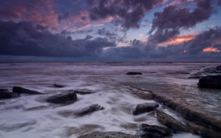 Rocky beach cloudy sky dusk - rich moody colour free wallpaper