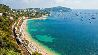 Beach train boats people scenery - a train free wallpaper