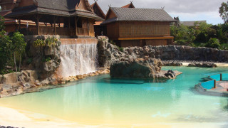 Pool waterfall architecture beach city - a building in the background free wallpaper