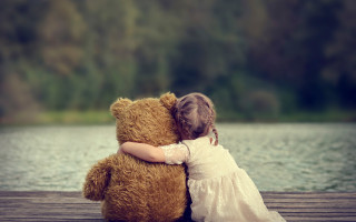 Little girl hugging teddy bear 2 - a little girl free wallpaper