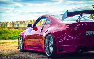 Pink sports car dirt road - a hood free wallpaper