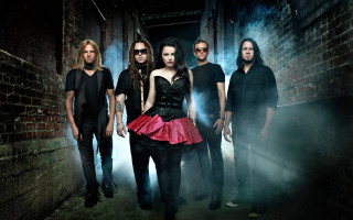 Alleyway gothic group smoke brick - a brick wall behind them free wallpaper