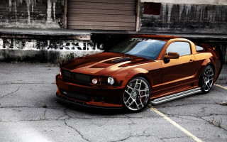 Brown mustang parking lot building - a parking lot next free wallpaper