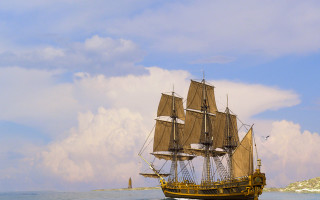 Sailboat ocean cloudy sky lighthouse - matte painting free wallpaper