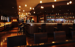 Dimly lit bar stools hanging 3 - bottle free wallpaper
